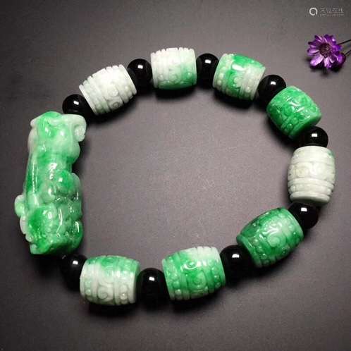 A NATURAL YANGLV JADEITE PIXIU DESIGN BRACELET