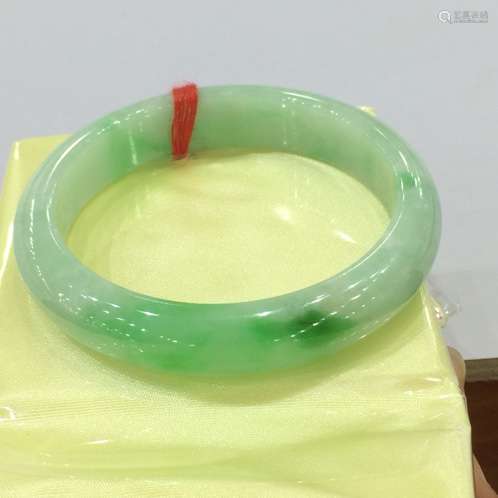 A NATURAL  JADEITE BANGLE