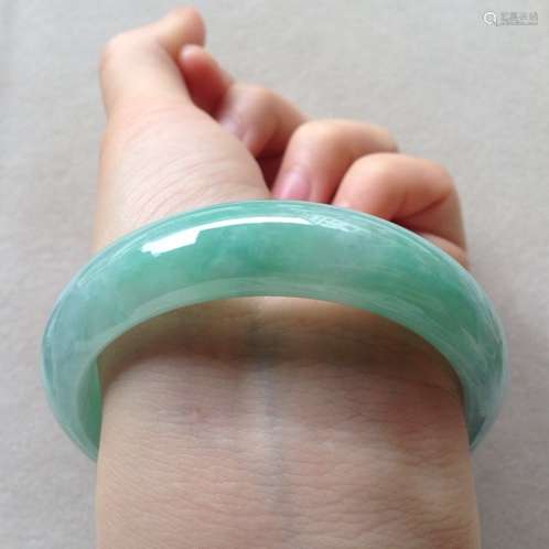 A NATURAL  JADEITE BANGLE