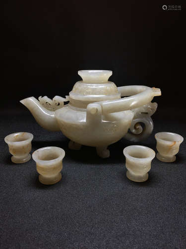 Set of Chinese carved jade teapot and four cups.