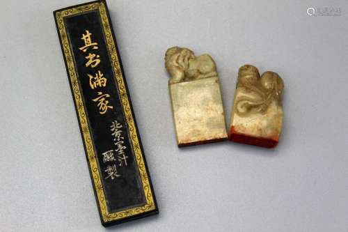 Two Chinese soapstone seals and one ink stick.