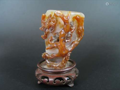 Chinese agate carving with wood stand.