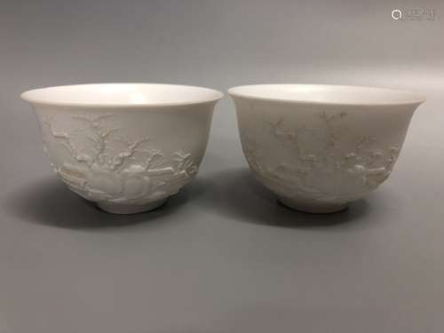 A Pair of Carved White Glazed Cups