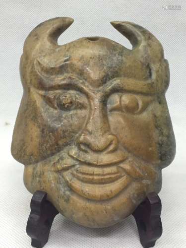 A Carved Figure Mask