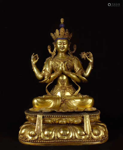 A BRONZE GLITED BUDDHA FIGURE