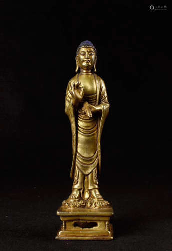 A BRONZE GLITED BUDDHA FIGURE