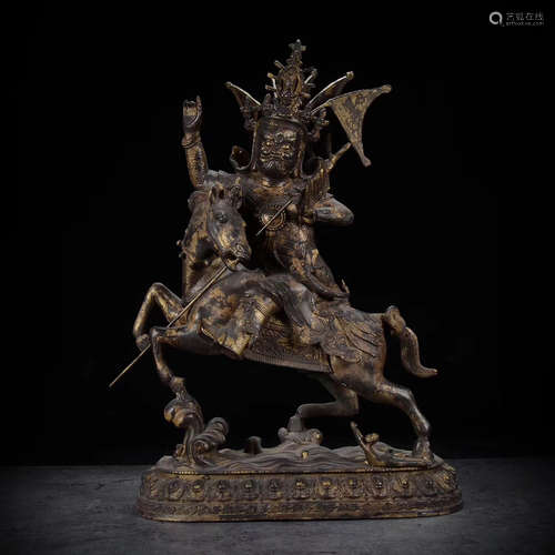 A BRONZE GLITED KING GESAR FIGURE