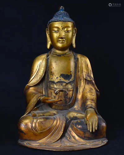 A BRONZE GLITED BUDDHA FIGURE