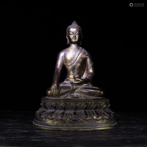 A BRONZE GLITED BUDDHA FIGURE