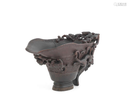 17th century A large archaistic rhinoceros horn 'nine dragon' libation cup