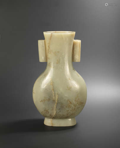 Qianlong four-character fanggu mark and of the period A rare and large Imperial incised pale green and black jade vase, hu