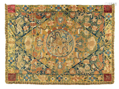 Circa 17th century  A rare and large silk 'dragons and Buddhist lions' hanging