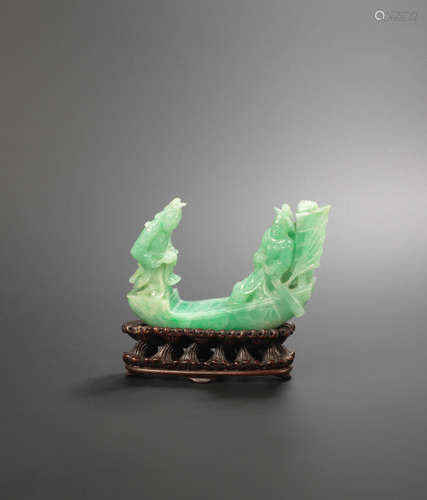 Late Qing Dynasty/ Republic Period A jadeite carving of a boat with three figures