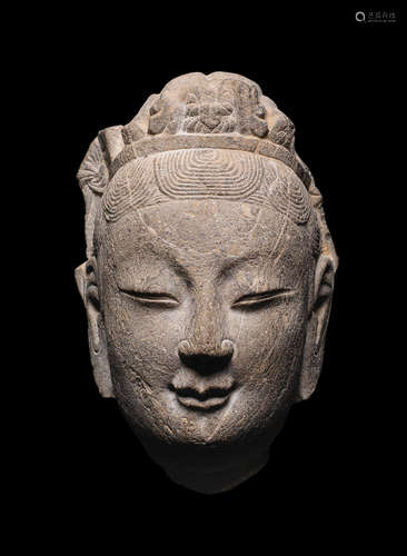 Probably Ming Dynasty  A carved stone head of a Bodhisattva