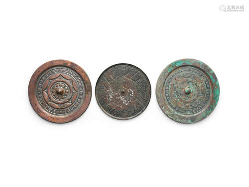 Three archaic bronze mirrors