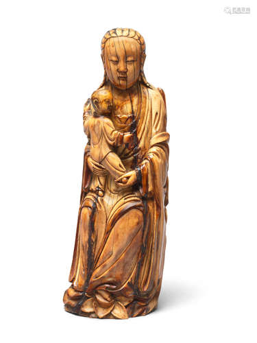 Late Ming Dynasty An ivory carving of Guanyin and boy