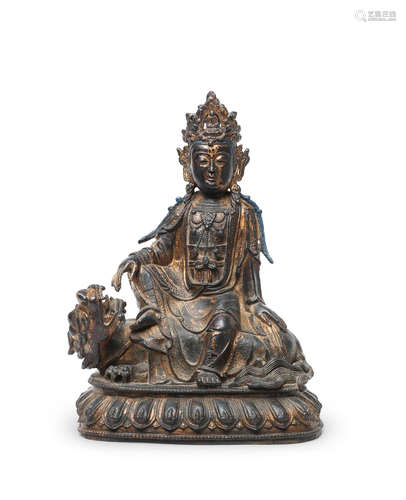 Ming Dynasty  A gilt-bronze figure of Guanyin on a Buddhist lion