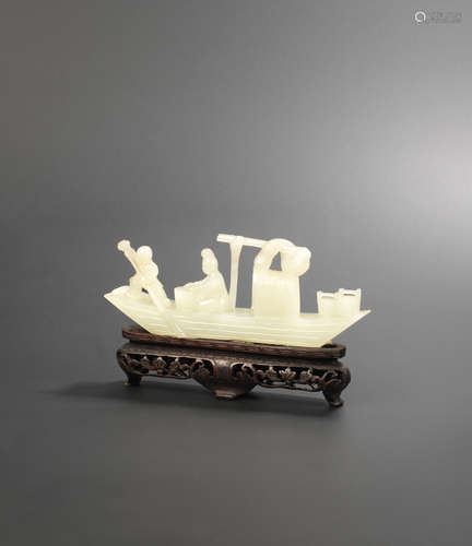 19th century A white jade carving of a sampan with a lady and boy