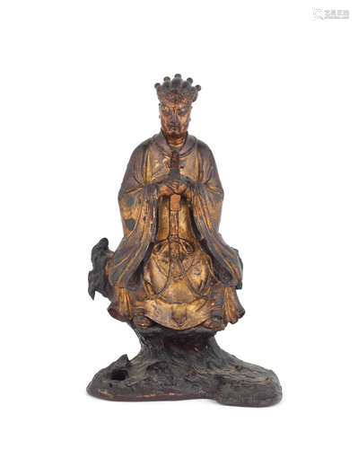 Ming Dynasty, 16th/17th century A gilt-lacquered bronze figure of a seated official