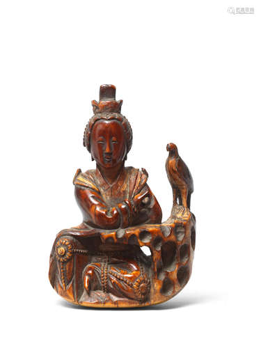 Late Ming Dynasty A rare ivory carving of a seated lady