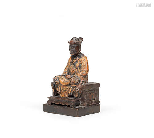 17th/18th century A rare gilt-lacquered wood figure of a seated monk