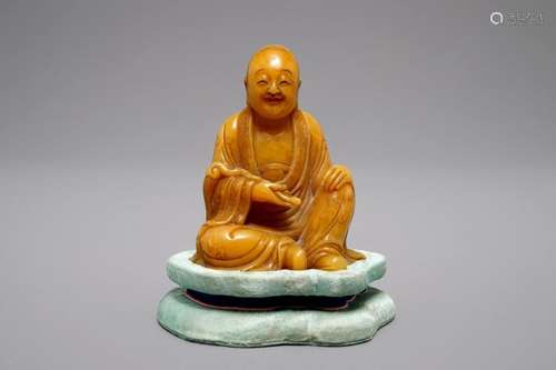 A CHINESE SHOUSHAN SOAPSTONE CARVING OF A LUOHAN, 18/19TH C.