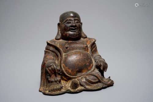 A CHINESE LACQUERED AND GILT BRONZE FIGURE OF BUDDHA, MING