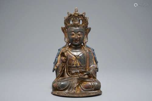 A CHINESE LACQUERED AND GILT BRONZE FIGURE OF GUANYIN, MING