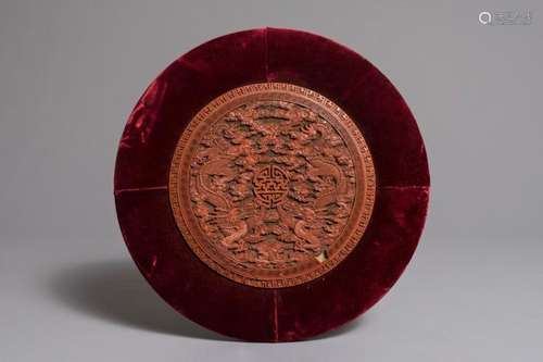 A ROUND CHINESE CINNABAR LACQUER PLAQUE WITH TWO DRAGONS, 18TH C.