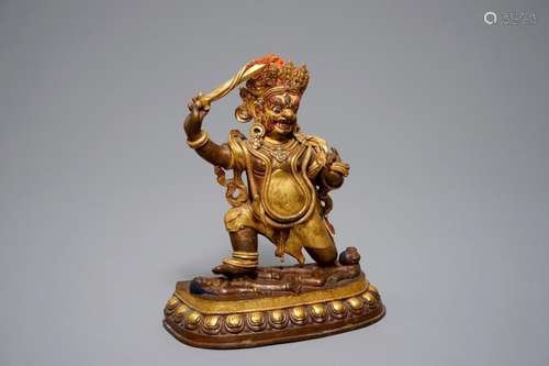 A SINO-TIBETAN GILT BRONZE FIGURE OF MAHAKALA, 19TH C.