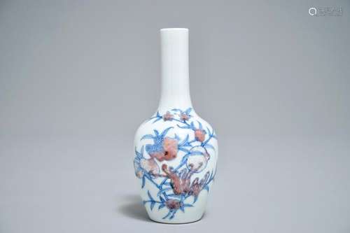 A CHINESE BLUE AND UNDERGLAZE RED 'SANDUO' VASE, KANGXI MARK, 19/20TH C.