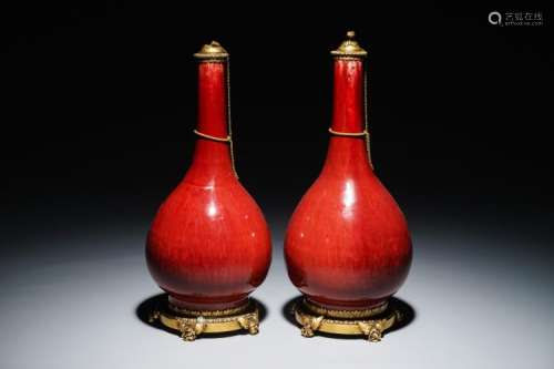 A PAIR OF CHINESE GILT BRONZE-MOUNTED OXBLOOD-GLAZED VASES, 19TH C.