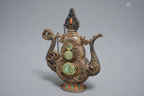 A SILVERD AND PARCEL-GILT BRASS JUG INLAID WITH TURQUOISE AND CORAL, TIBET OR MONGOLIA, 19TH C.