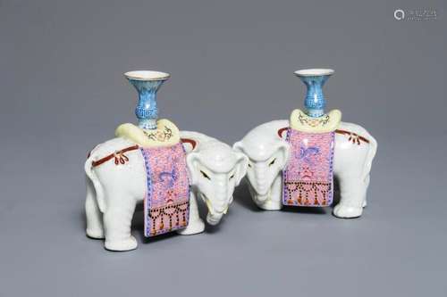 A PAIR OF CHINESE FAMILLE ROSE ELEPHANT-FORM CANDLESTICKS, 19TH C.