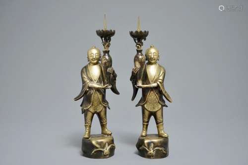 A PAIR OF CHINESE BRONZE 'HEHE ER XIAN BROTHERS' CANDLESTICKS, 19/20TH C.