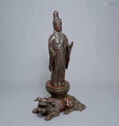 A LARGE JAPANESE BRONZE GROUP OF KANNON ON A SHI-SHI, MEIJI, 19TH C.