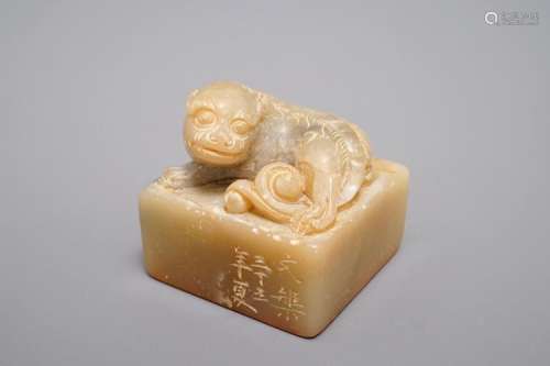 AN INSCRIBED AND DATED CHINESE SHOUSHAN STONE SEAL WITH A BUDDHIST LION