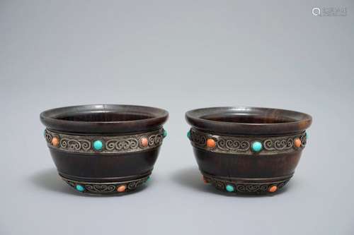 A PAIR OF TIBETAN WOODEN CUPS WITH TURQUOISE- AND CORAL-INLAID SILVER MOUNTS, 19TH C.