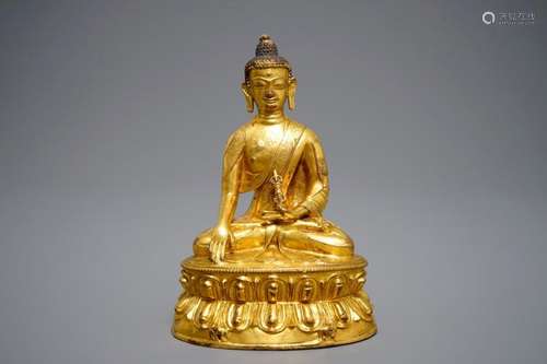 A TIBETAN GILT BRONZE FIGURE OF BUDDHA WITH VAJRA, 19TH C.