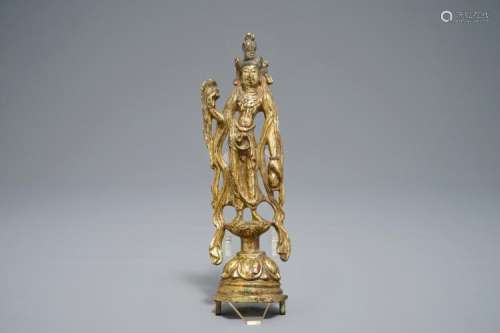 A CHINESE GILT BRONZE FIGURE OF GUANYIN, TANG OR LATER