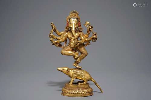 A SINO-TIBETAN GILT BRONZE FIGURE OF GANESHA, 19/20TH C.