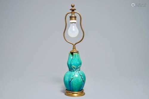A CHINESE TURQUOISE-GLAZED THREE-SPOUTED VASE WITH BRONZE LAMP MOUNTS, 19TH C.