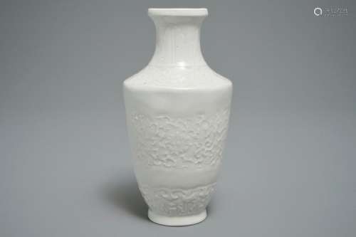 A CHINESE RELIEF-DECORATED BLANC DE CHINE VASE, 19/20TH C.