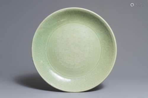 A MASSIVE CHINESE LONGQUAN CELADON DISH WITH UNDERGLAZE DESIGN, MING