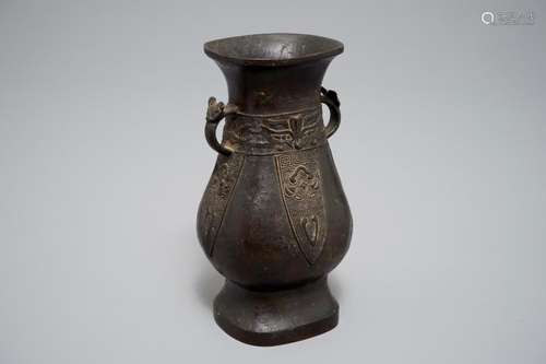 A CHINESE ARCHAISTIC BRONZE HU VASE, MING