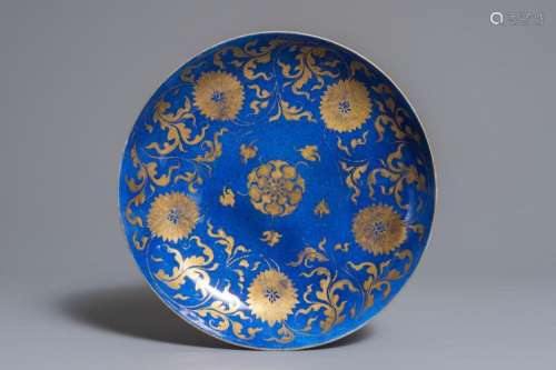 A CHINESE POWDER BLUE AND GILT LOTUS SCROLL PLATE, KANGXI