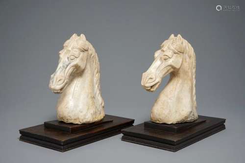 A PAIR OF CHINESE CARVED MARBLE HORSE HEADS, POSS. TANG