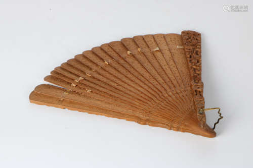 A carved Sandalwood fan