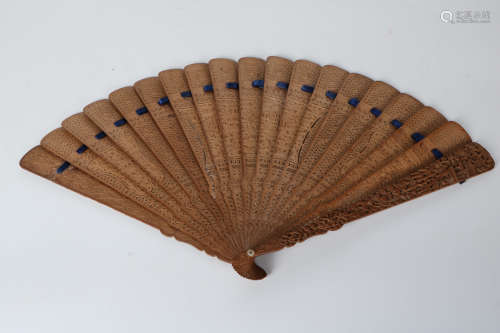 A carved Sandalwood fan