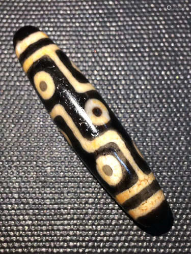 A CINNABAR NINE EYES DZI BEAD